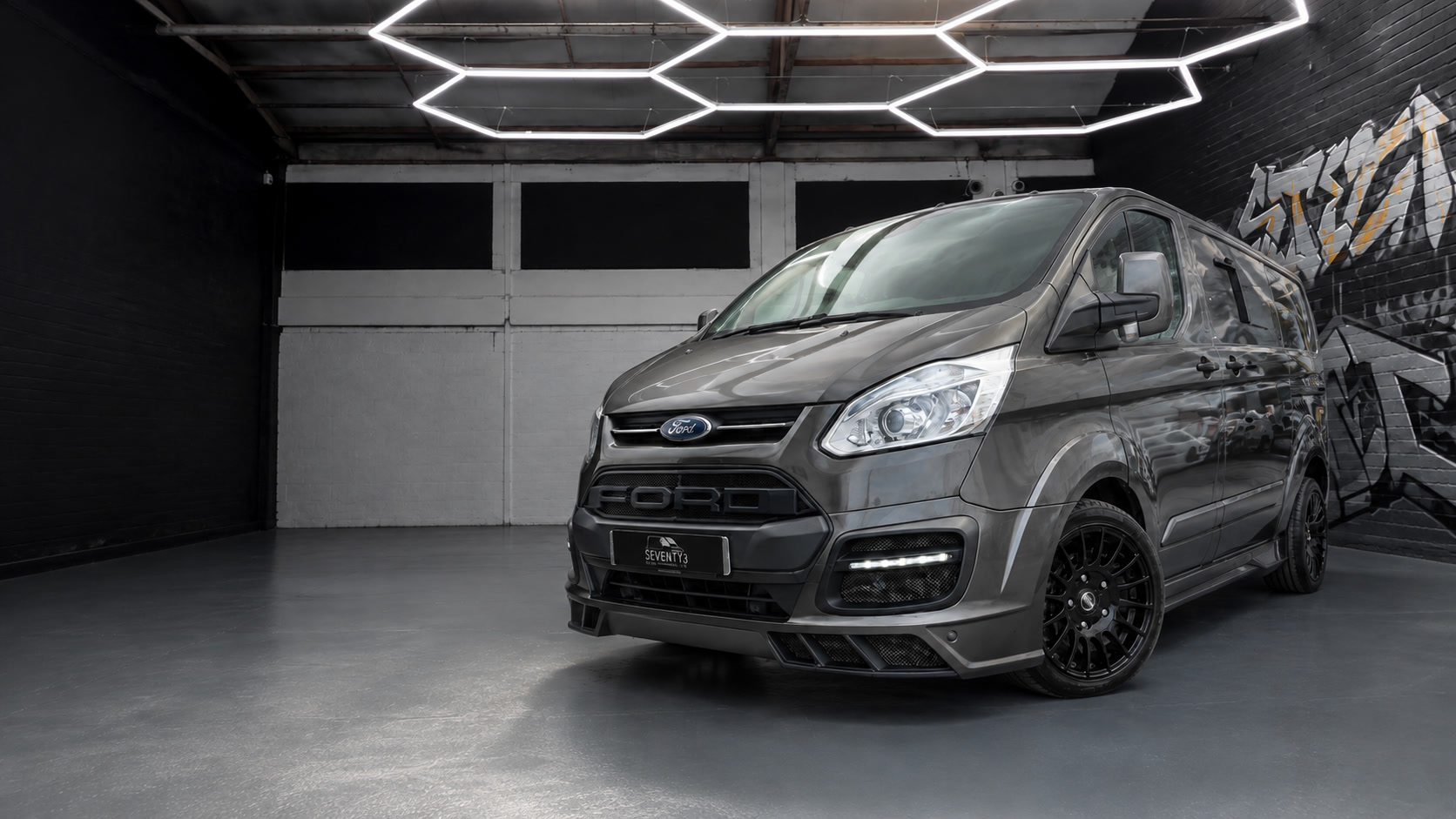 A customised Seventy3 Ford Transit in the showroom